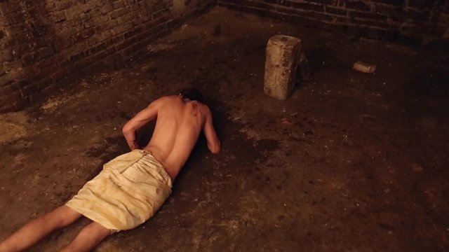 man falls into a puddle