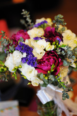Beautiful multicolored wedding bouquet on a table