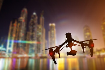 Drone with 4K camera flying.