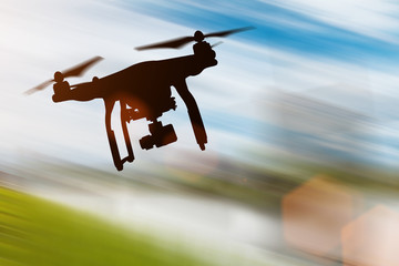 Drone with 4K camera flying.