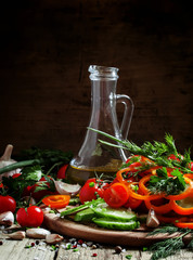 Fresh vegetables, chopped for salad, garlic, spices, herbs and o