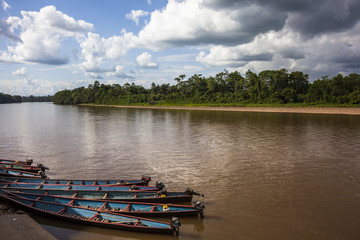 Wooden canoe in river port
