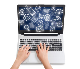 female hand typing on tablet computer and media icons fly