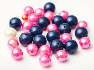 many blue and pink glass and plastic beads