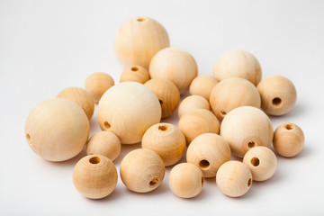 several natural wooden beads on white