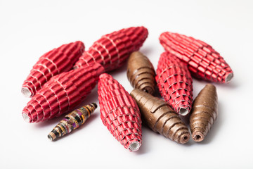 several handmade paper and leather beads