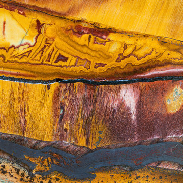 texture of Tiger's eye mineral gem stone close uo