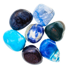 pile of blue natural mineral gemstones isolated