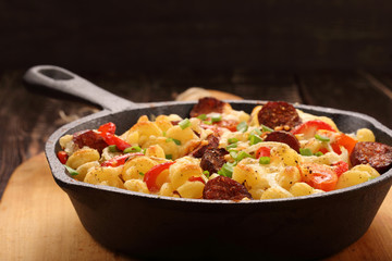Casserole with chorizo sausage in a frying pan