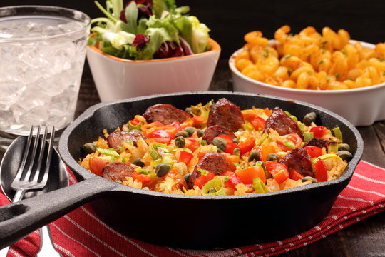 Rice with chorizo sausage and vegetables baked in a pan