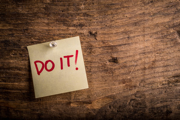 do it! - motivation paper note on wood noticeboard - right text space


