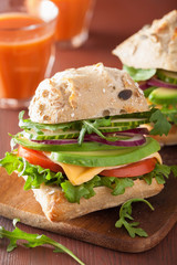 tomato avocado cheese sandwich with cucumber onion