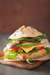 tomato avocado cheese sandwich with cucumber onion