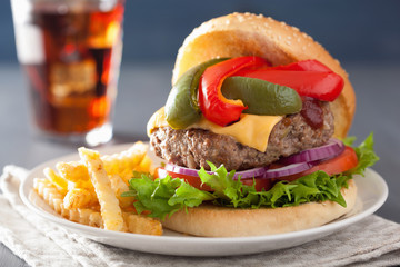 homemade cheese burger with peppers tomato onion