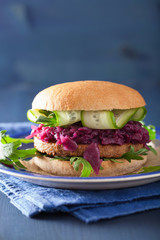 veggie soy burger with pickled red cabbage cucumber arugula