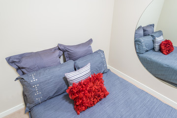 Modern brown bedroom interior with red pillow in a luxury house