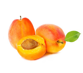 Ripe apricots with leaf isolated on a white background, with clipping path.