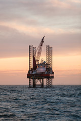 Oil platform at sunset