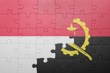 puzzle with the national flag of angola and indonesia