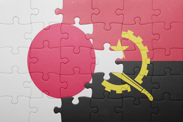 puzzle with the national flag of angola and japan