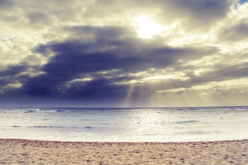 ray of sun over the beach at Kauai, Hawaii with cloudy sky