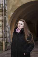 Fototapeta premium Beautiful woman with a long hair in a fur coat