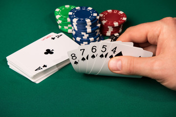 Poker hand in male arm