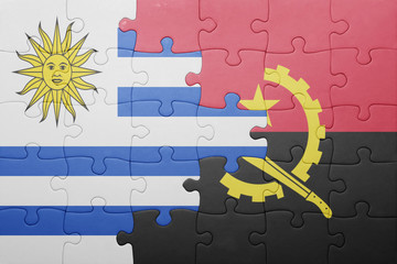 puzzle with the national flag of angola and uruguay