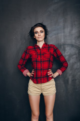 Young hipster girl looking at the camera