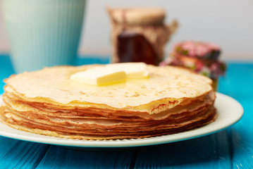 Close up at pancakes with butter