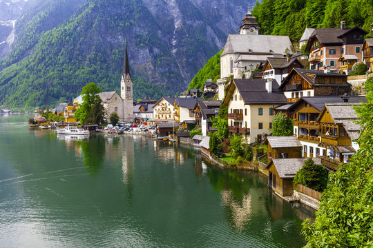emerald lake and beautiful village Halstatt in Austrian Alps