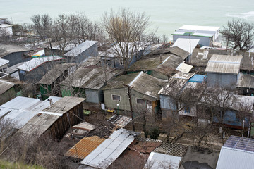 Fototapeta na wymiar Poor and dirty slum by the sea