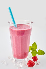 Long row of tropical fruit drinks in tall glasses