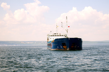The ship bulk carrier at anchor in front of the entrance to the Port of Gdansk