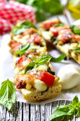 Pizza with eggplants on a french baguette.