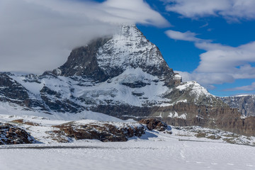 Fototapeta premium Amazing landscape of matterhorn peak covered with clods, Alps, Switzerland