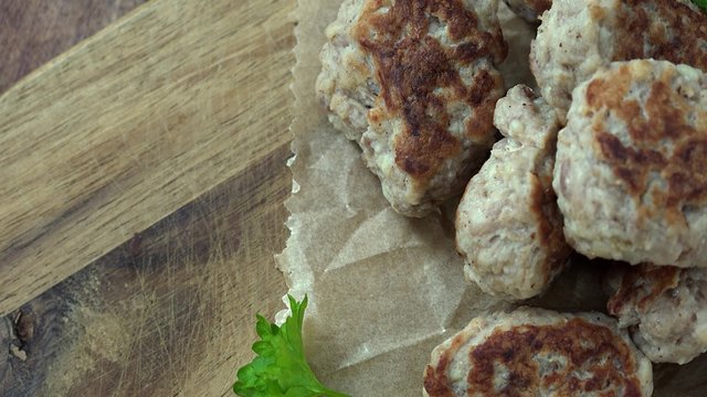 Portion of rotating Mini Burgers (seamless loopable 4K UHD footage)