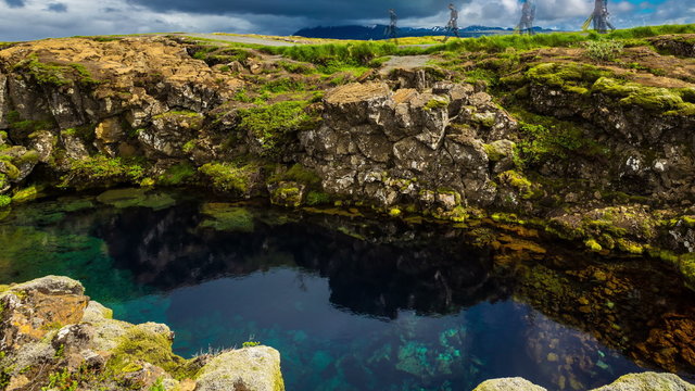 4K TimeLapse. Canyon Penningagja, deep, water-filled crack. The rippling water. Thingvellir National Park, Iceland. 15 June 2015