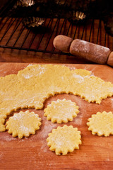 Baking set with cookies and rolling pin on a wooden background
