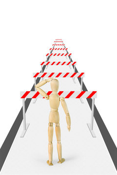 Man stands on the way with a lot of barriers. Abstract image with a wooden puppet