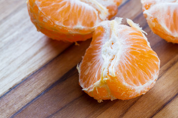 peeled orange on a cutting board