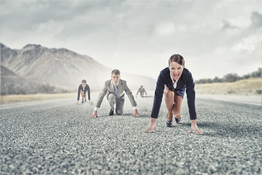 Business people running race