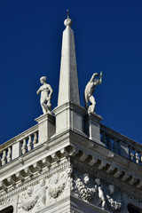Naklejka premium Biblioteca Marciana beautiful renaissance balustrade with statues of classical gods, designed by the famous Jacopo Sansovino in the 16th century in Saint Mark Square.