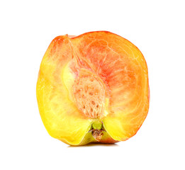 Peach cut half on white background.