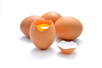 Close up of cracked egg isolated on white background