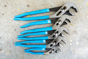 Mechanic tools on scratched background