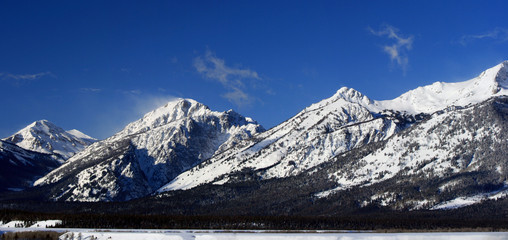 Grand Tetons Mountain Range under cirrus mist clouds in Grand Teton National Park Wyoming USA