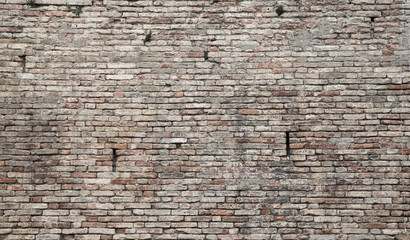 Old grungy dark brick wall, close up background
