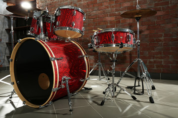 Drum set on brick wall background