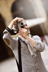 Man taking pictures on travel journey